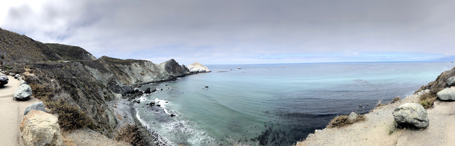 A panorama of a cove below a rest area at Big Sur